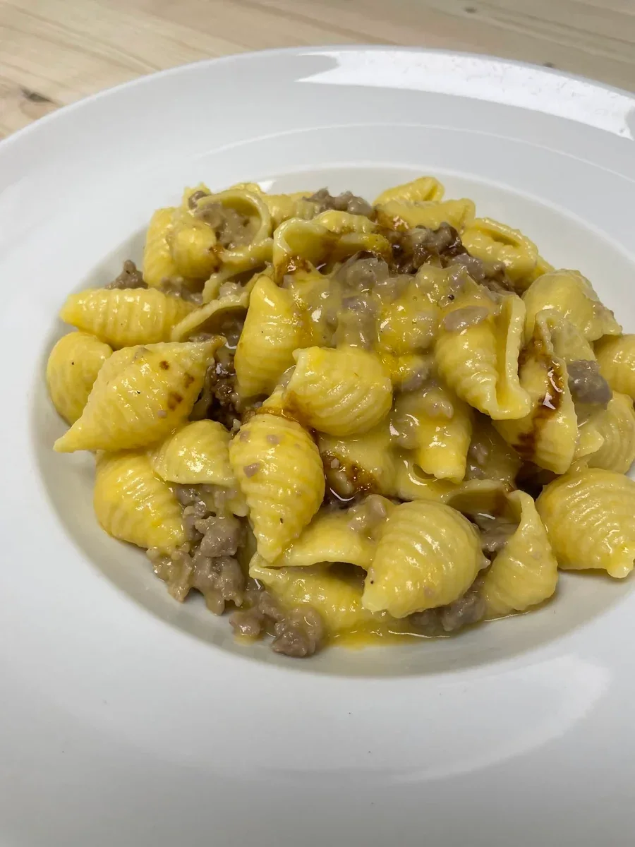 Conchiglie with pumpkin cream, sausage crumbs, and balsamic vinegar at Davanti