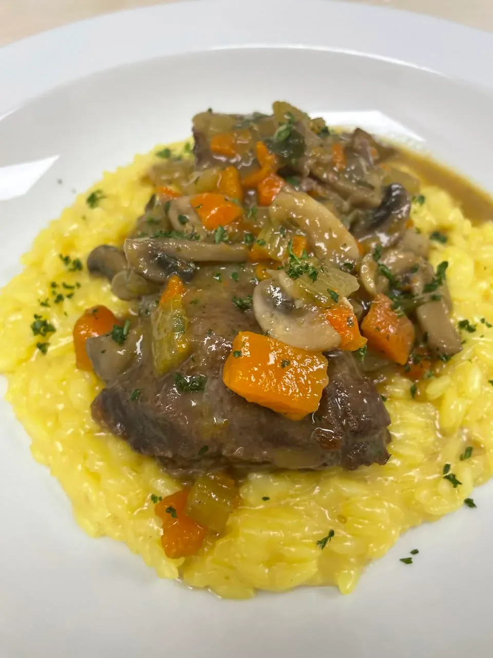 Braised veal cheek with baby bella mushrooms and saffron risotto at Davanti
