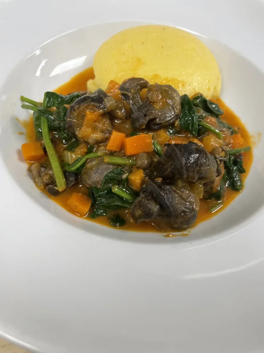 Lumache alla Bresciana with tomato, spinach, vegetables, and grilled polenta at Davanti