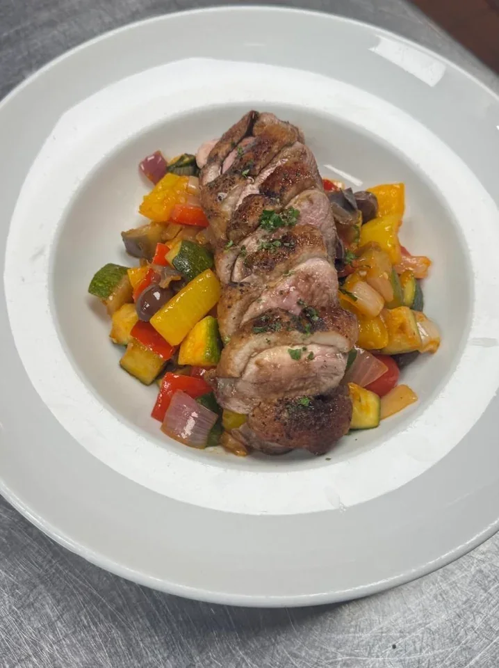 Sliced duck breast with balsamic reduction and caponata on a Davanti archive plate