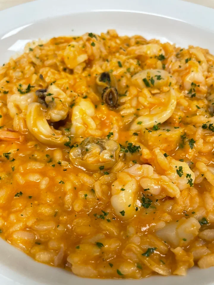 Archive view of Risotto alla Pescatora with marinara and baby cuttlefish