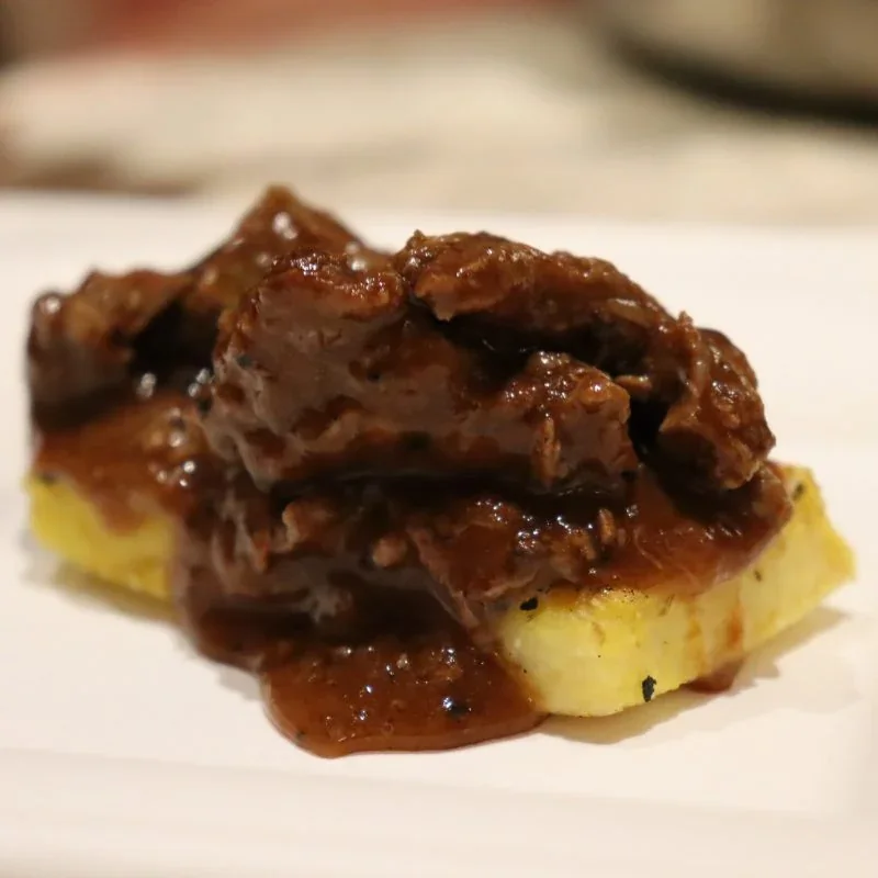 Archive view of Stufato di Cervo alla Tirolese con Cantarelli e Polenta plated at Davanti