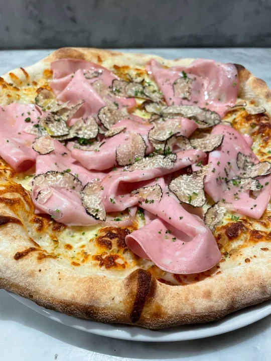 Hero archive view of Pizza con Mortadella e Tartufo Nero plated at Davanti