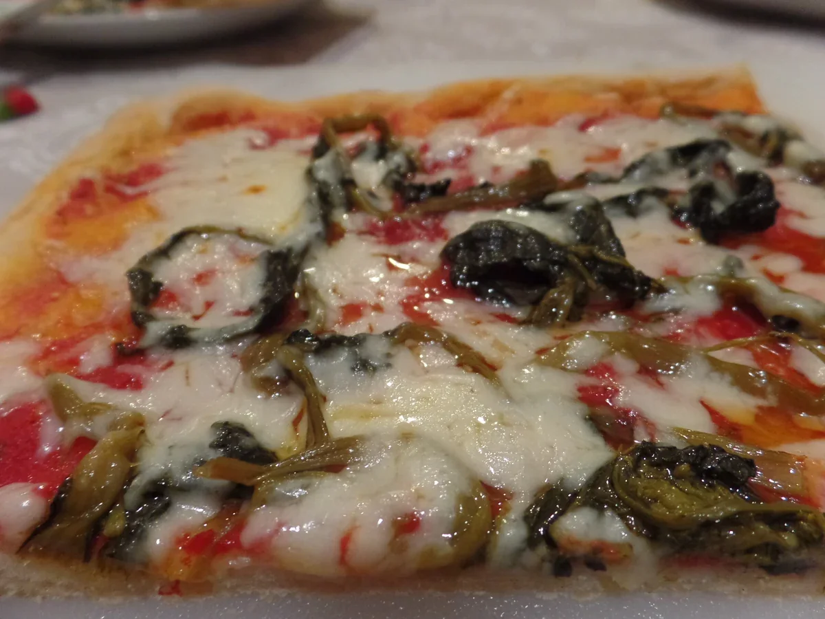 Hero archive view of Pizza con Stracciatella, Acciughe e Rapini plated at Davanti