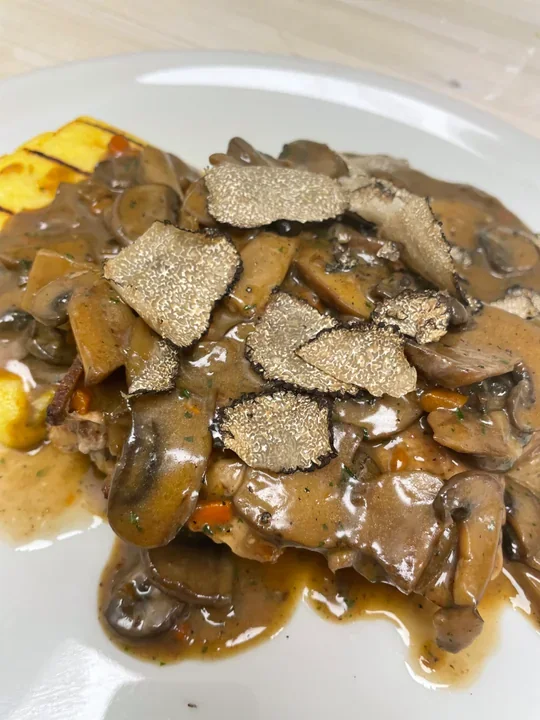 Hero archive view of Nodino di Vitello in Salsa di Funghi e Tartufo Nero Estivo plated at Davanti