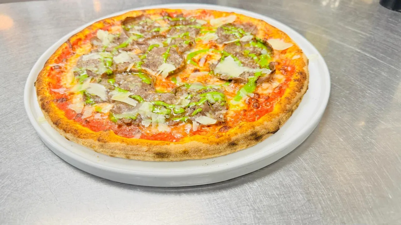 Archive view of Pizza con Carne Salada alla Trentina plated at Davanti