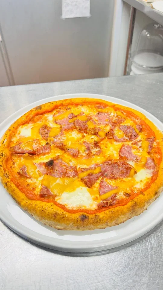 Archive view of Pizza con Crema di Pomodori Secchi, Squacquerone, Zucca e Salame Napoletano plated at Davanti