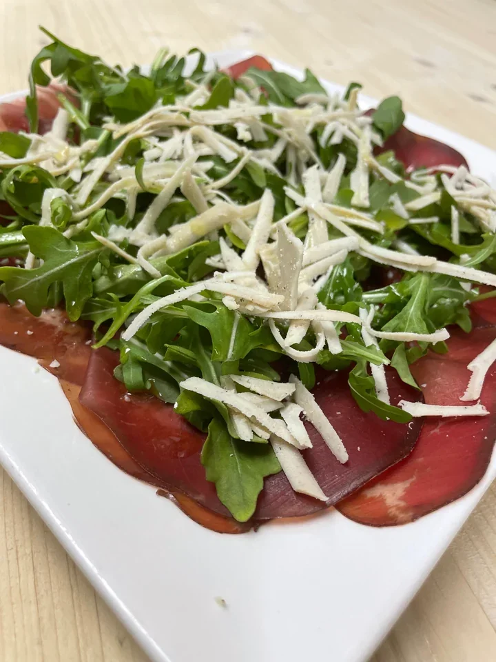 Archive view of Bresaola della Valtellina con Ricotta al Tartufo e Rucola plated at Davanti