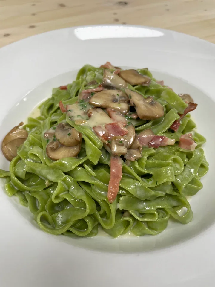 Archive view of Fettuccine Verdi ai Funghi, Taleggio e Speck plated at Davanti
