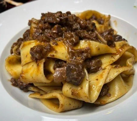 Archive view of Tagliatelle con Cinghiale alla Bresciana plated at Davanti