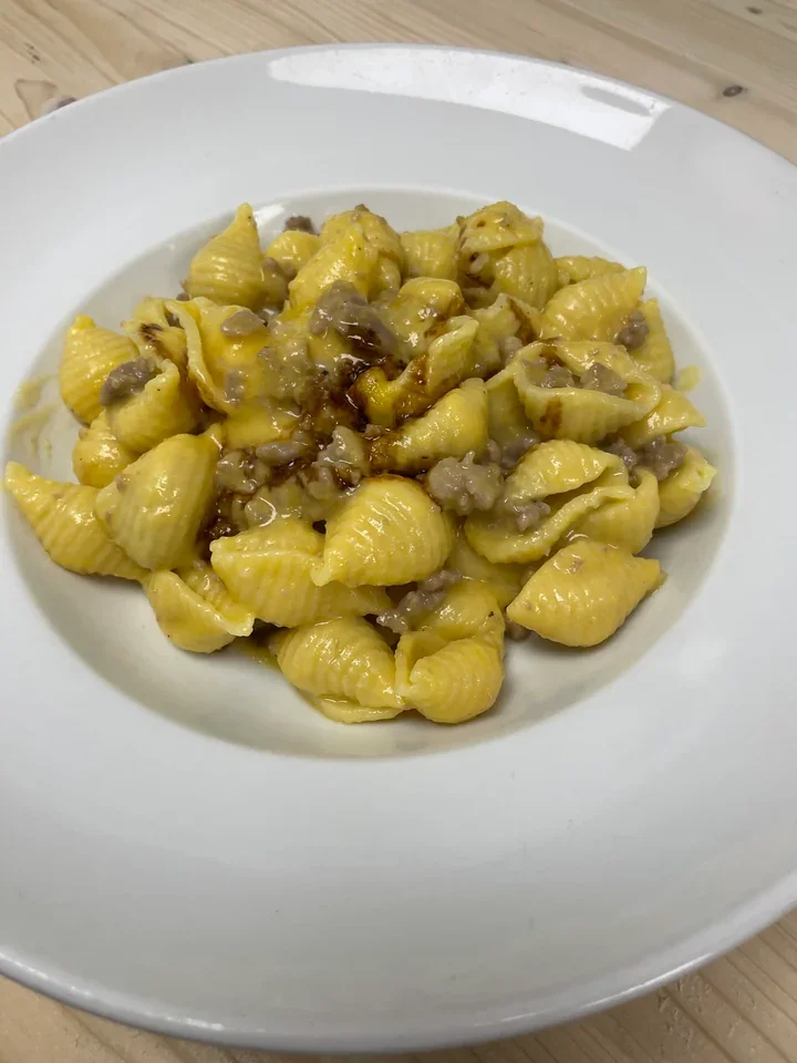 Archive view of Conchiglie con Crema di Zucca e Salsiccia plated at Davanti