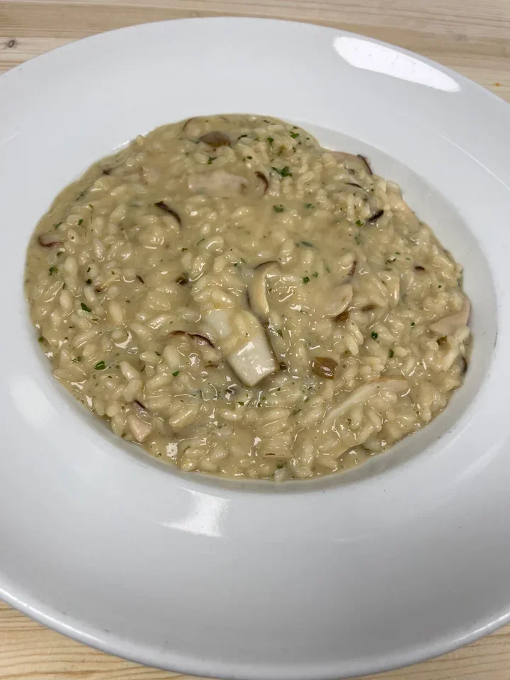 Archive view of Risotto ai Porcini plated at Davanti