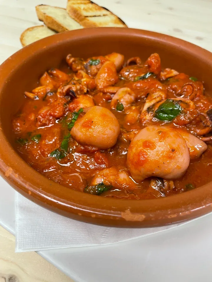 Archive view of Moscardini e Seppioline in Purgatorio (Baby Octopus and Baby Cuttlefish in Purgatory) plated at Davanti