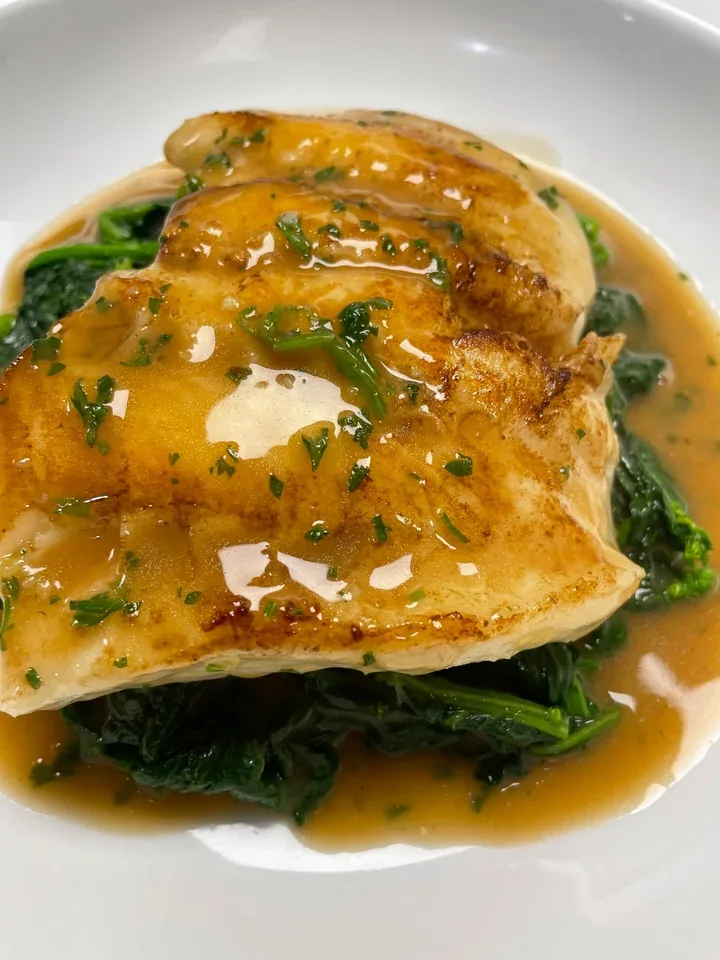Archive view of Chilean Seabass in Salsa di Vino Rosso plated at Davanti