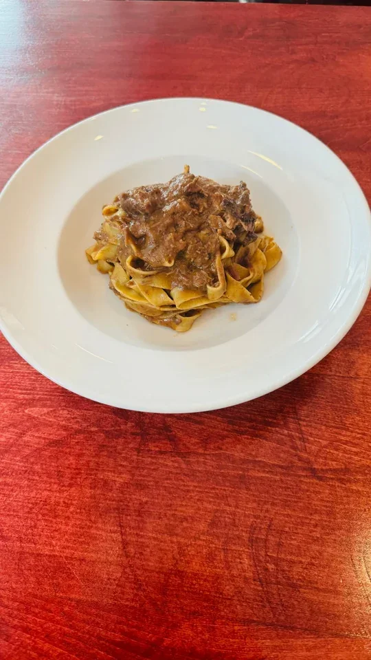 Archive view of Tagliatelle con Cinghiale alla Umbra plated at Davanti