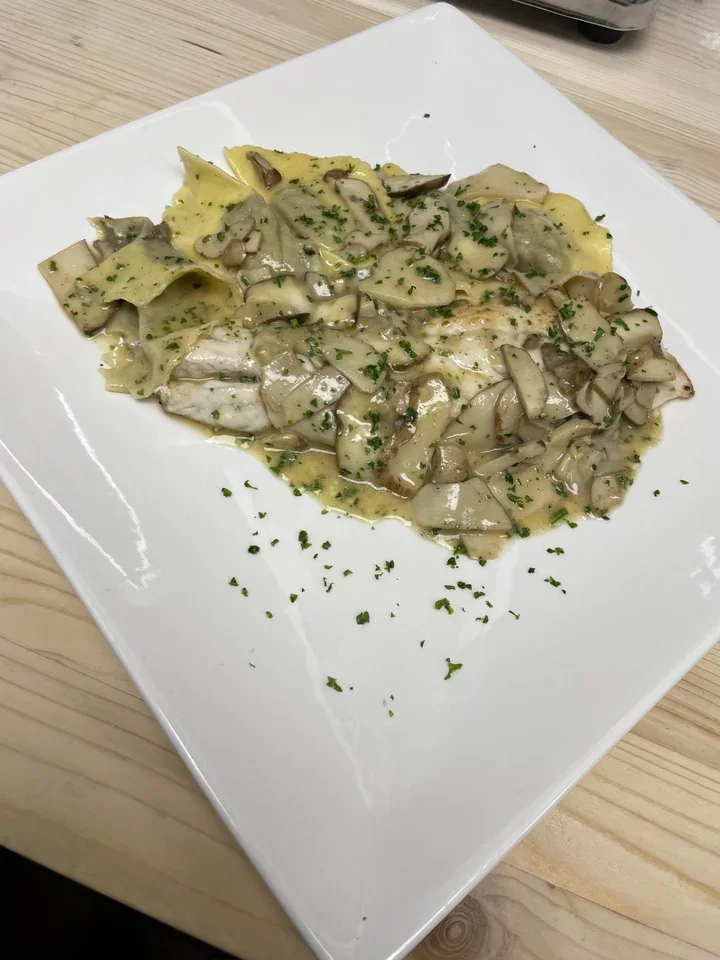 Archive view of Filetto di Branzino ai Porcini Freschi e Ravioli di Funghi plated at Davanti