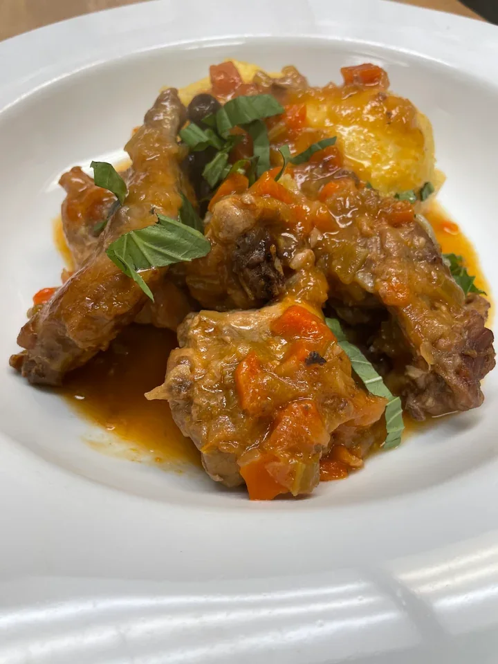 Archive view of Coniglio alla Cacciatora plated at Davanti
