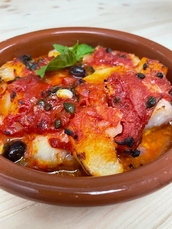 Archive view of Merluzzo alla Livornese plated at Davanti
