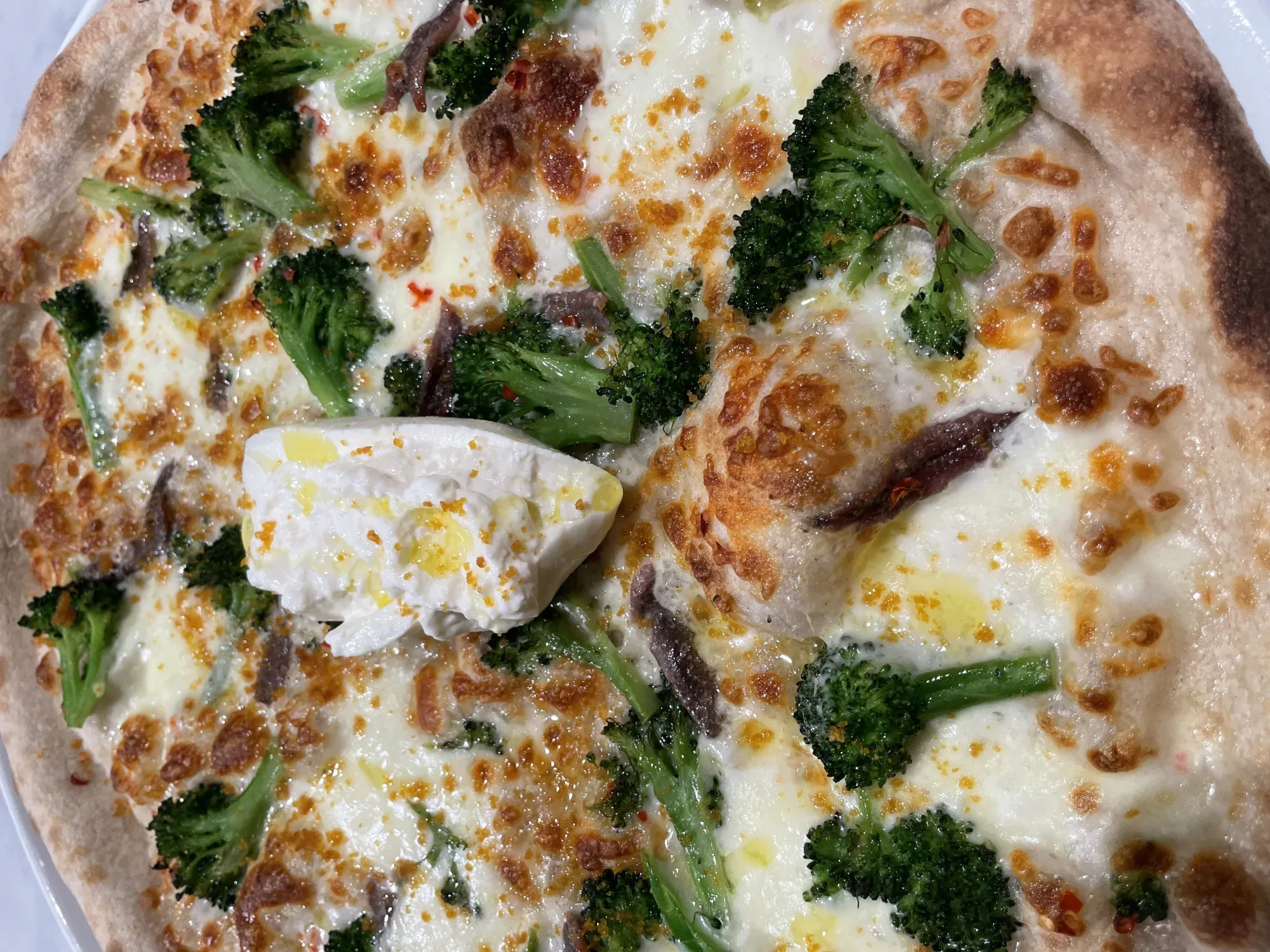 Davanti pizza with broccoletti, burrata, anchovies, and mullet bottarga