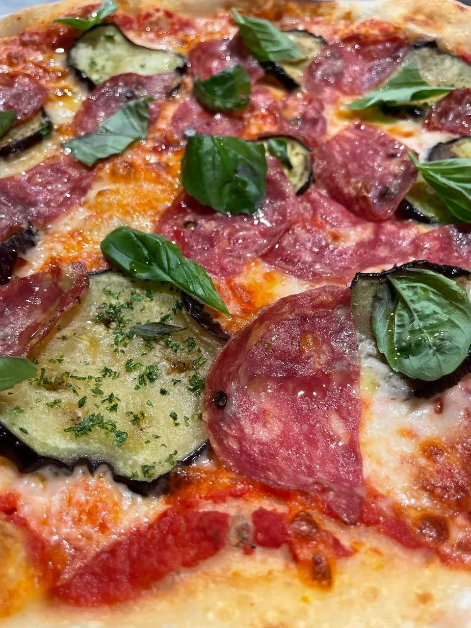 Pizza with marinara, mozzarella, eggplant and salame Napoletano at Davanti
