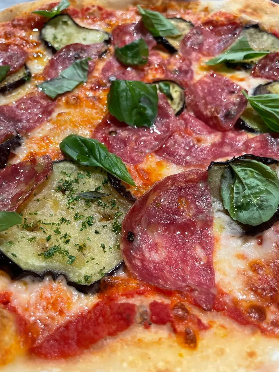 Pizza with marinara, mozzarella, eggplant and salame Napoletano at Davanti