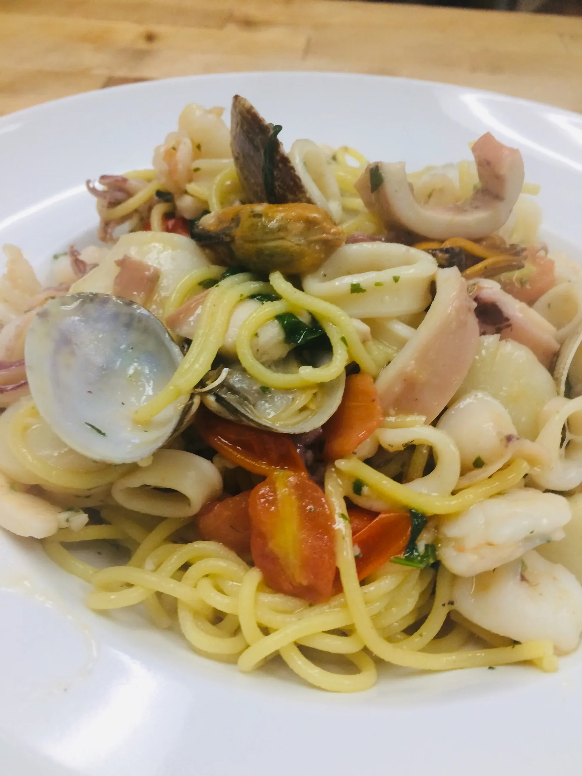 Davanti's Spaghetti ai Frutti di Mare with shrimp, shellfish, tomato, and basil